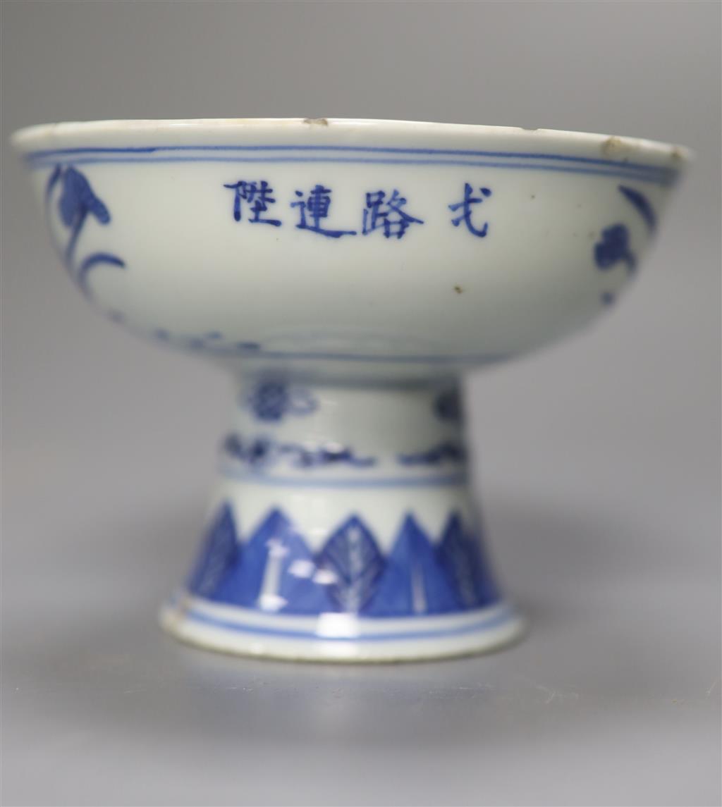 A late 19th century Chinese blue and white porcelain stem cup, decorated throughout with cranes, Qianlong mark to side, 8cm high, 11cm